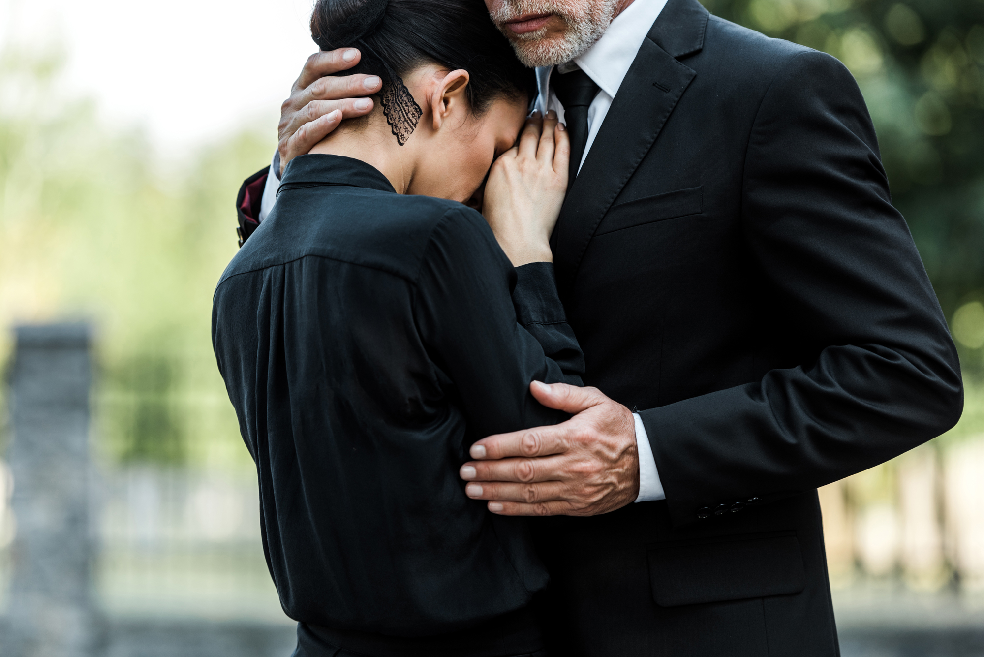 cropped-view-of-sad-elderly-man-embracing-woman-on-2022-12-16-18-04-16-utc1